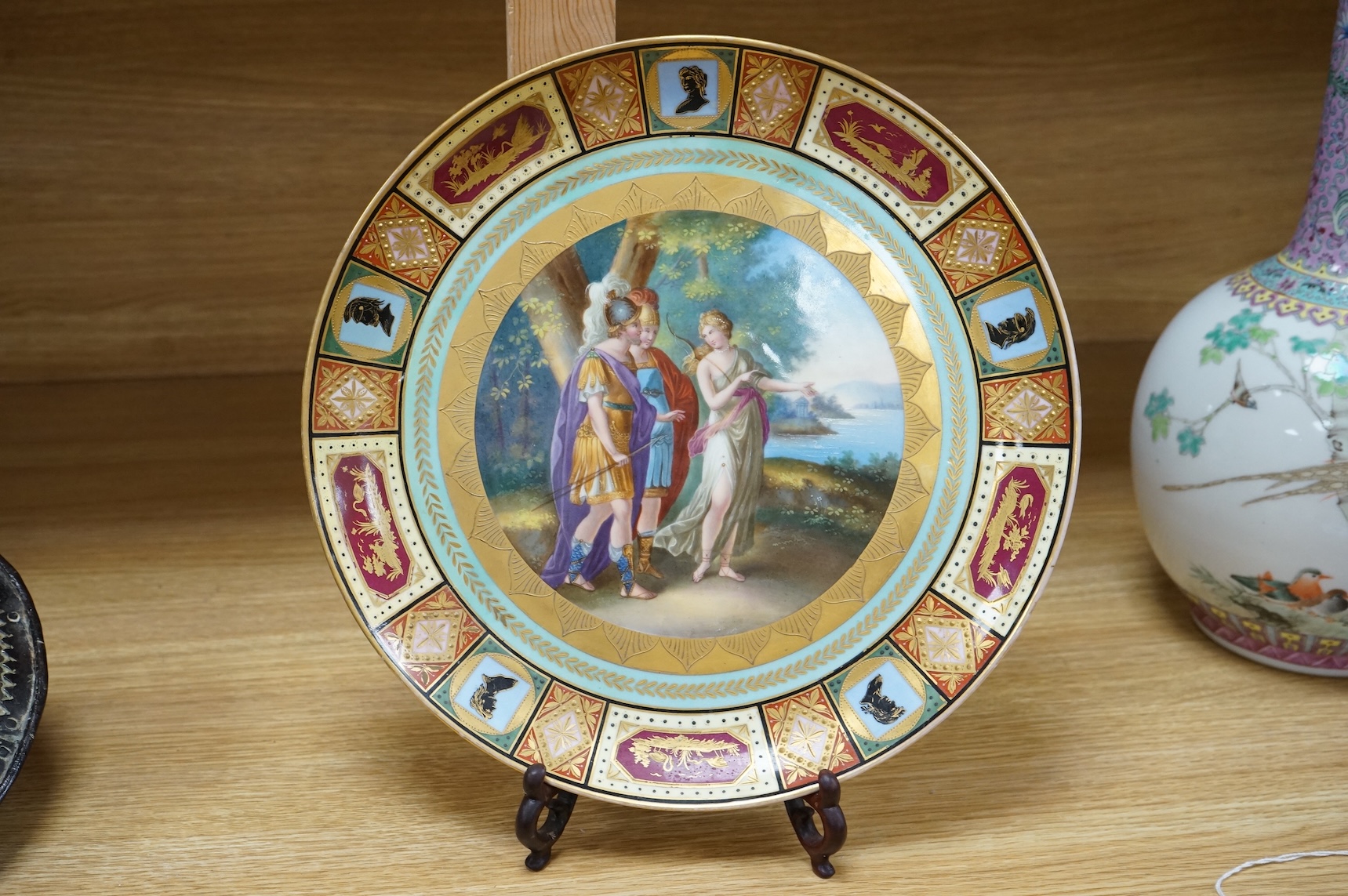 A Vienna style cabinet dish, c.1900, with central cartouche of Ulysses, Achilles and Thetis. 30cm diameter.